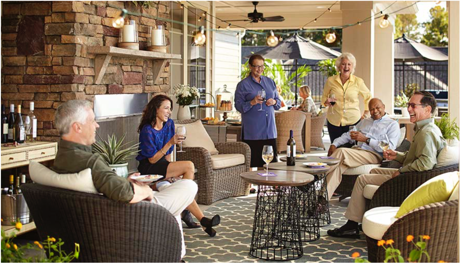 A group of poeple age 55+ having a patio party