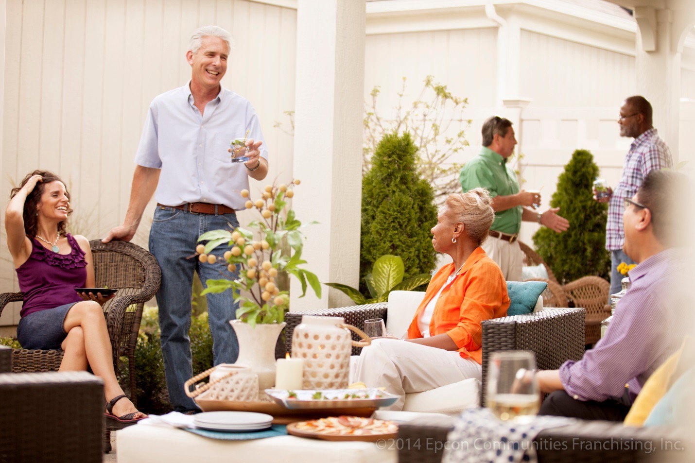 6 people socializing on a Epcon Communities home patio