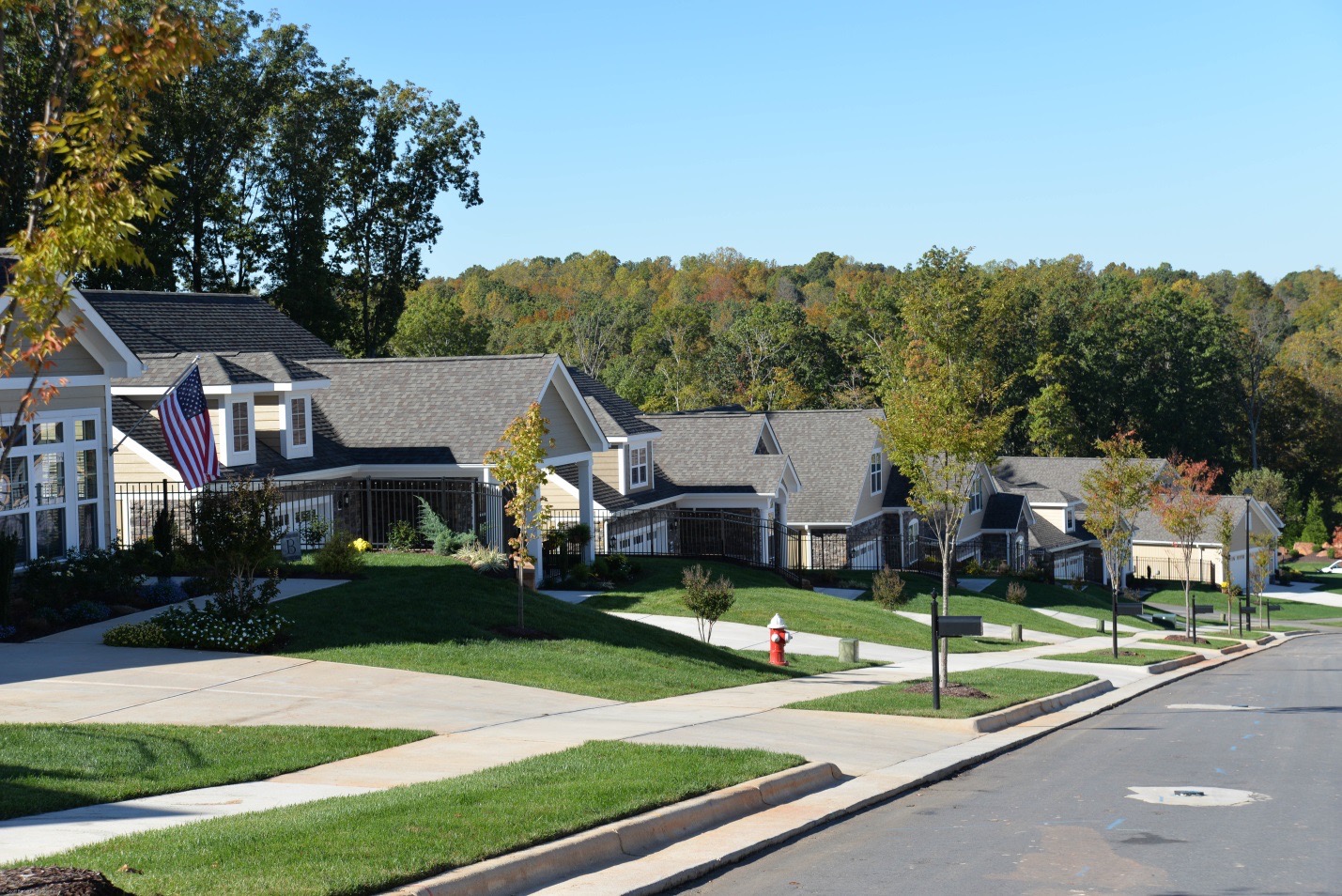 A street-view of an row of Epcon Community single-family homes