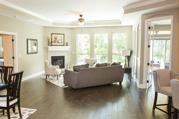 The view of an Epcon living from with a fireplace from the dining room.