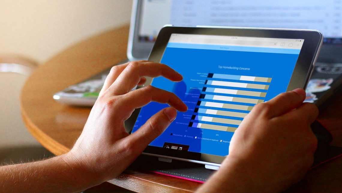 Person zooming in on the Epcon Franchising Builder Perceptions Report on an ipad